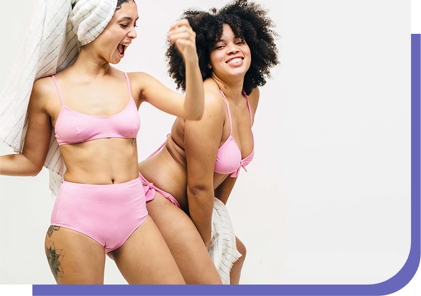 two woman dancing in underwear