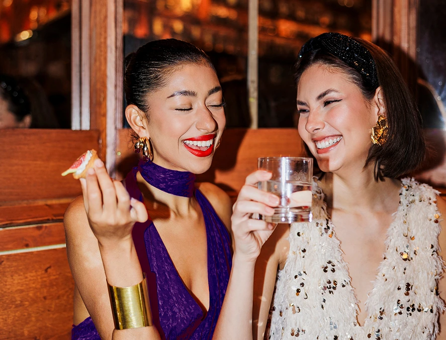 Two ladies enjoying drinks