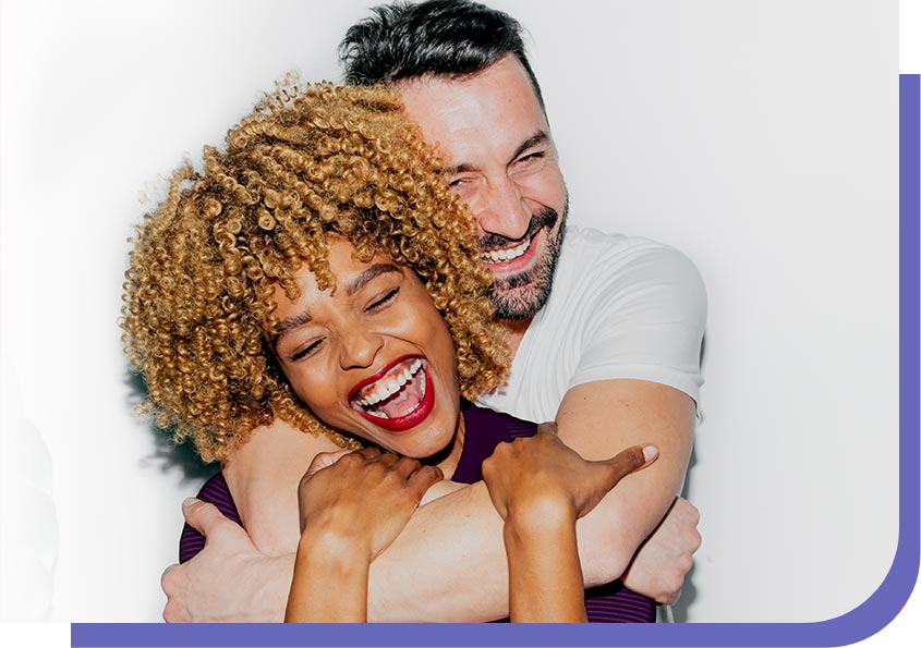 man hugging woman from behind